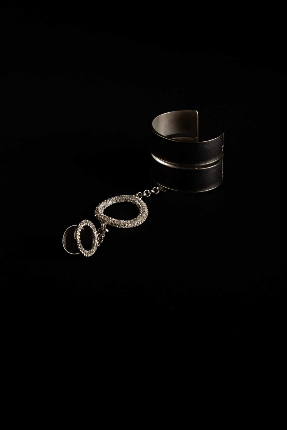 Zylberstein French fashion luxury statement bold jewelry silver palladium metal leather cuff with detachable chain and adjustable circle ring with Swarovski crystals rings