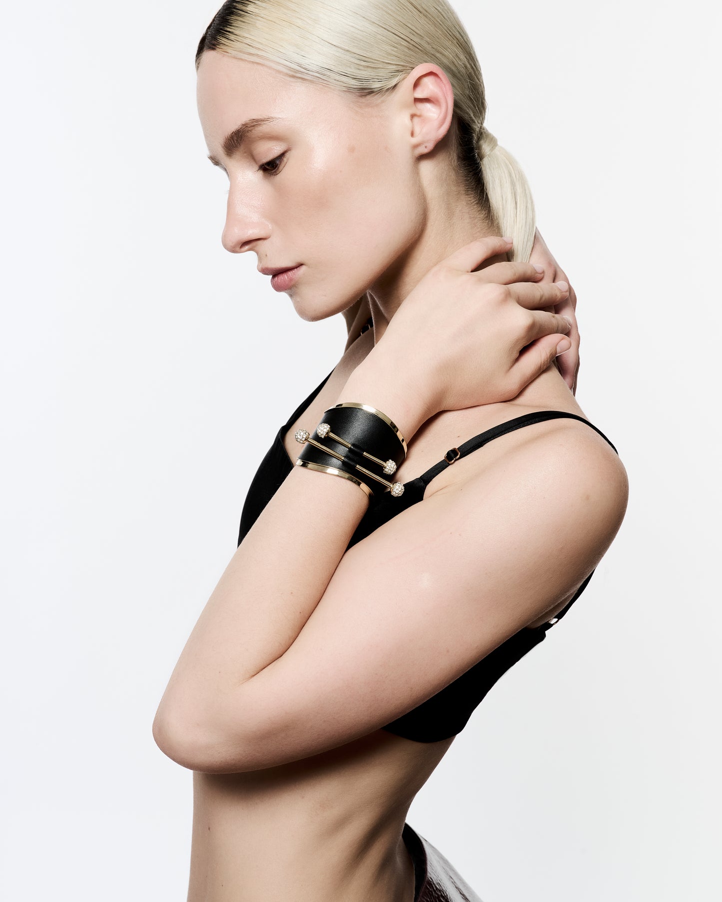 Zylberstein French luxury statement fashion gold cuff with barbell piercing jewelry with sustainable leather and swarovski crystals