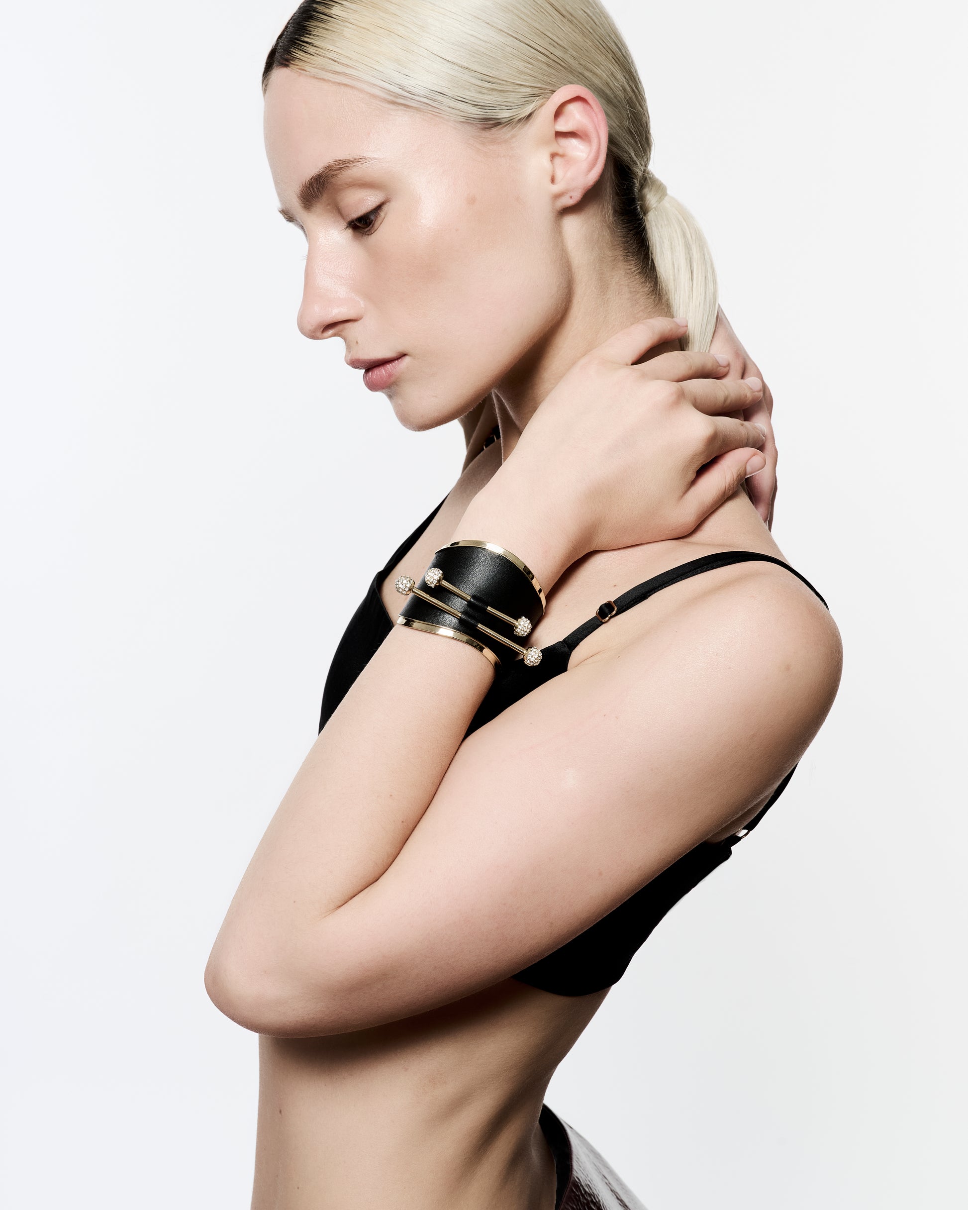 Zylberstein French luxury statement fashion gold cuff with barbell piercing  jewelry with sustainable leather and swarovski crystals