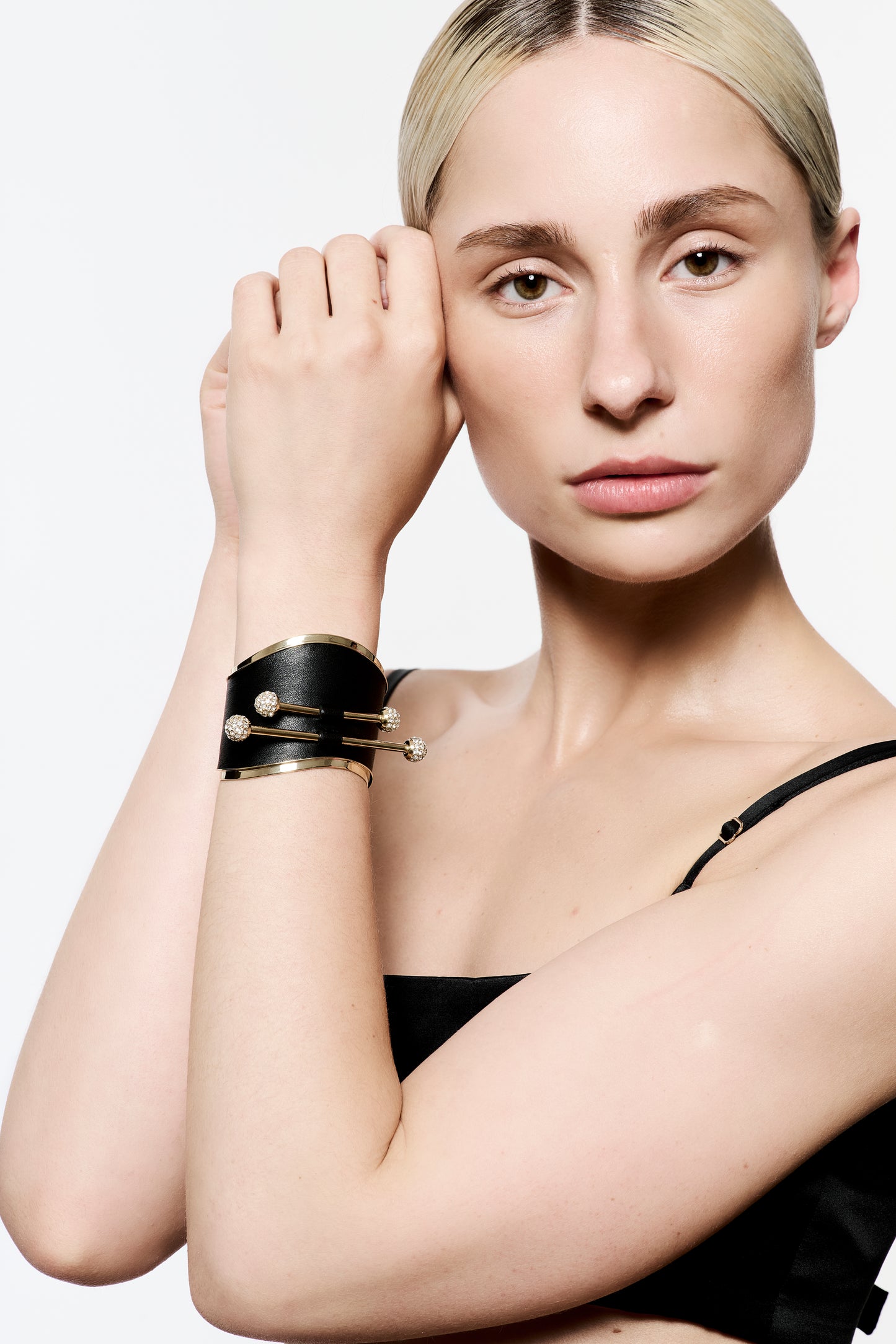 Zylberstein French luxury statement fashion gold cuff with barbell piercing jewelry with sustainable leather and swarovski crystals