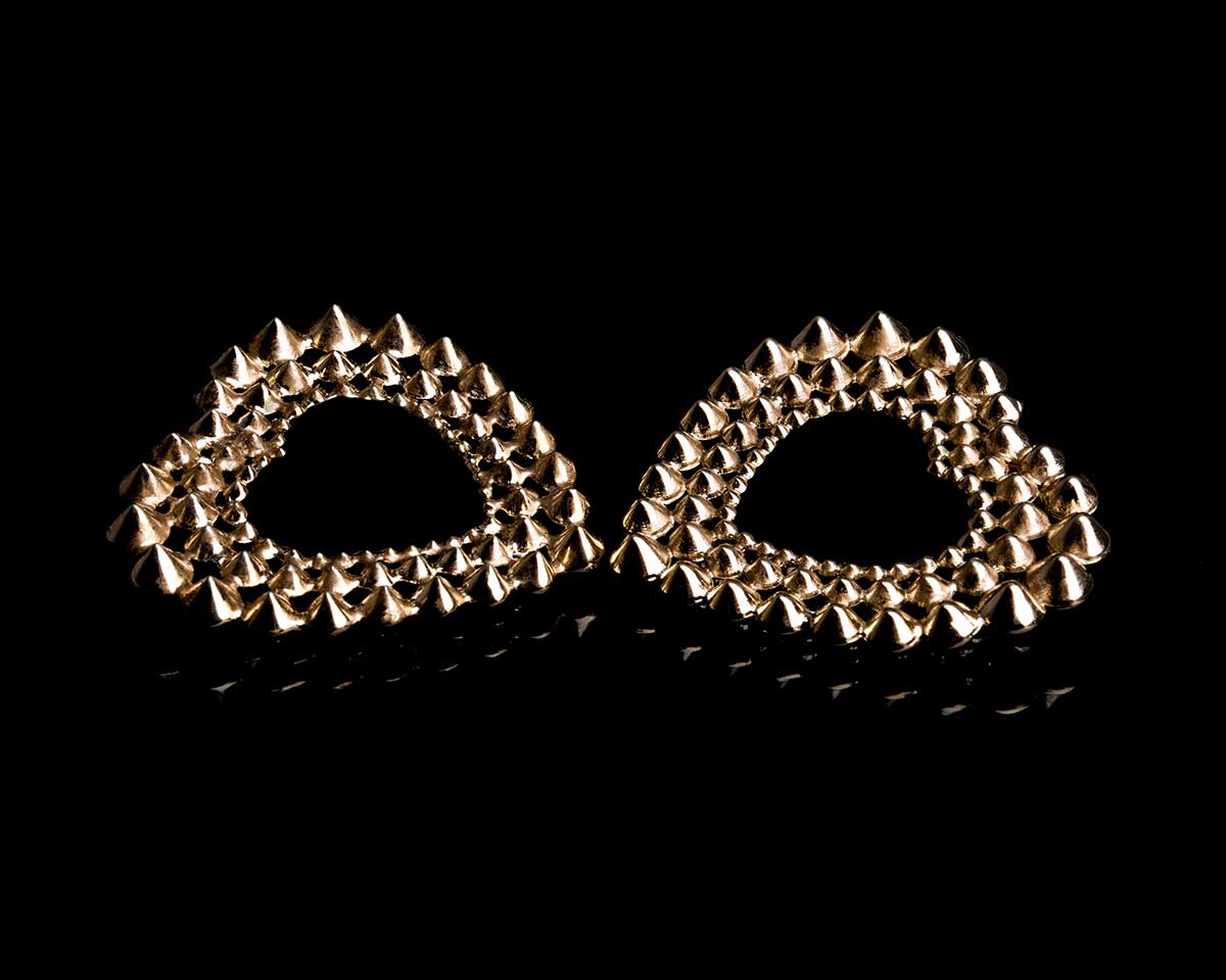 French designer punk rock couture fashion luxury gold trendy sustainable statement spike studded heart earrings