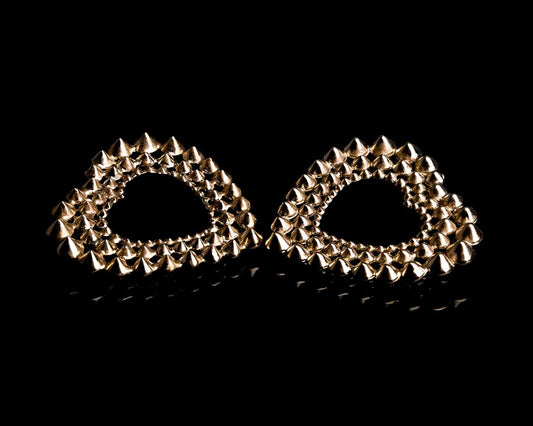 French designer punk rock couture fashion luxury gold trendy sustainable statement spike studded heart earrings