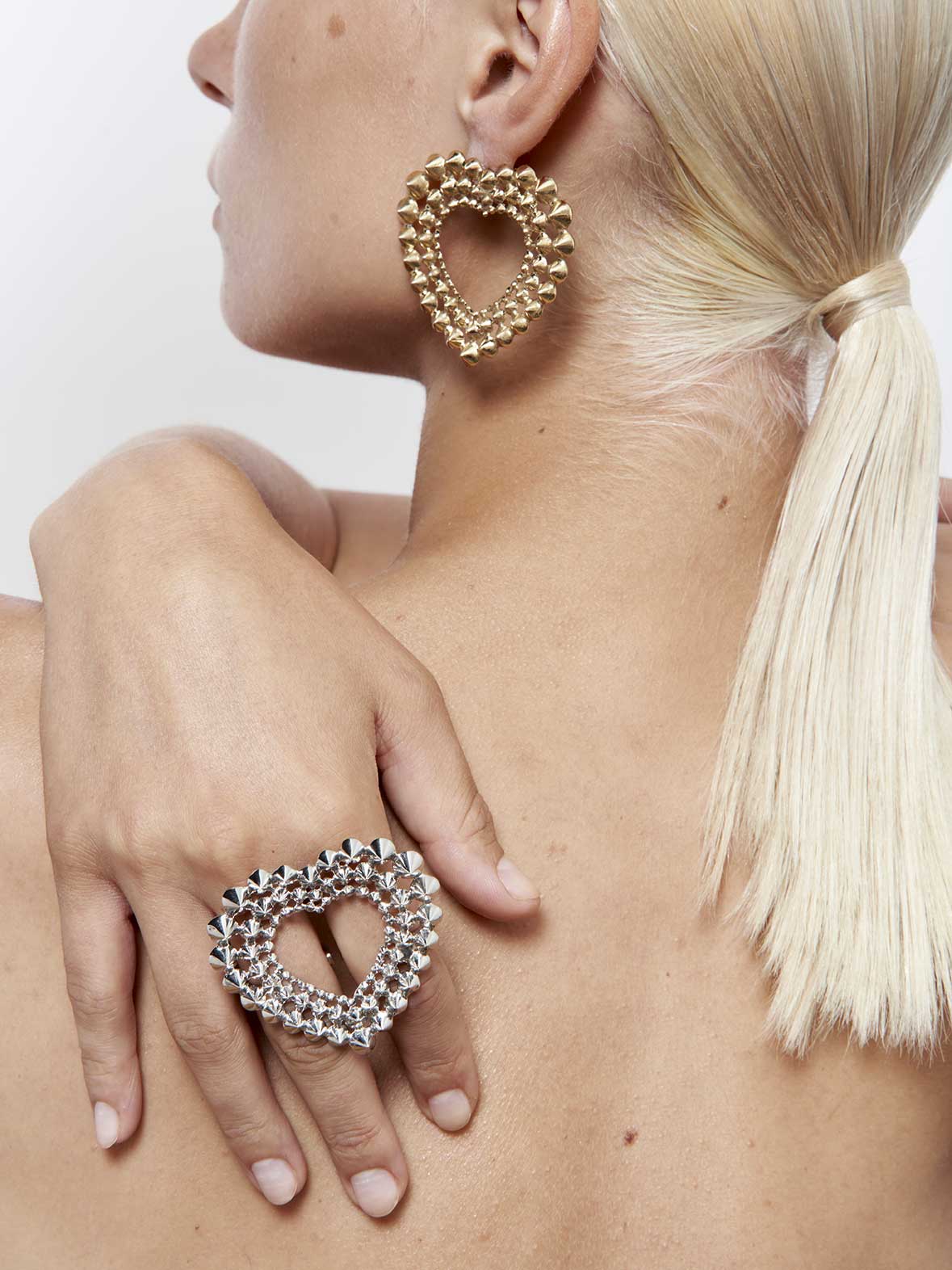 French designer punk rock couture fashion luxury gold trendy sustainable statement spike studded heart earrings