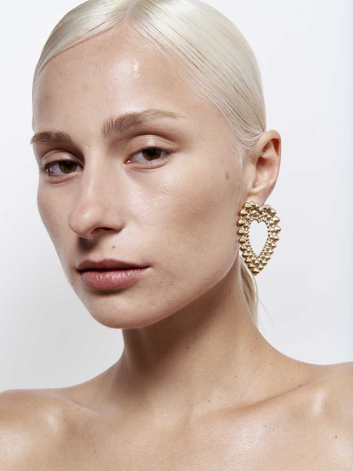 French designer punk rock couture fashion luxury gold trendy sustainable statement spike studded heart earrings