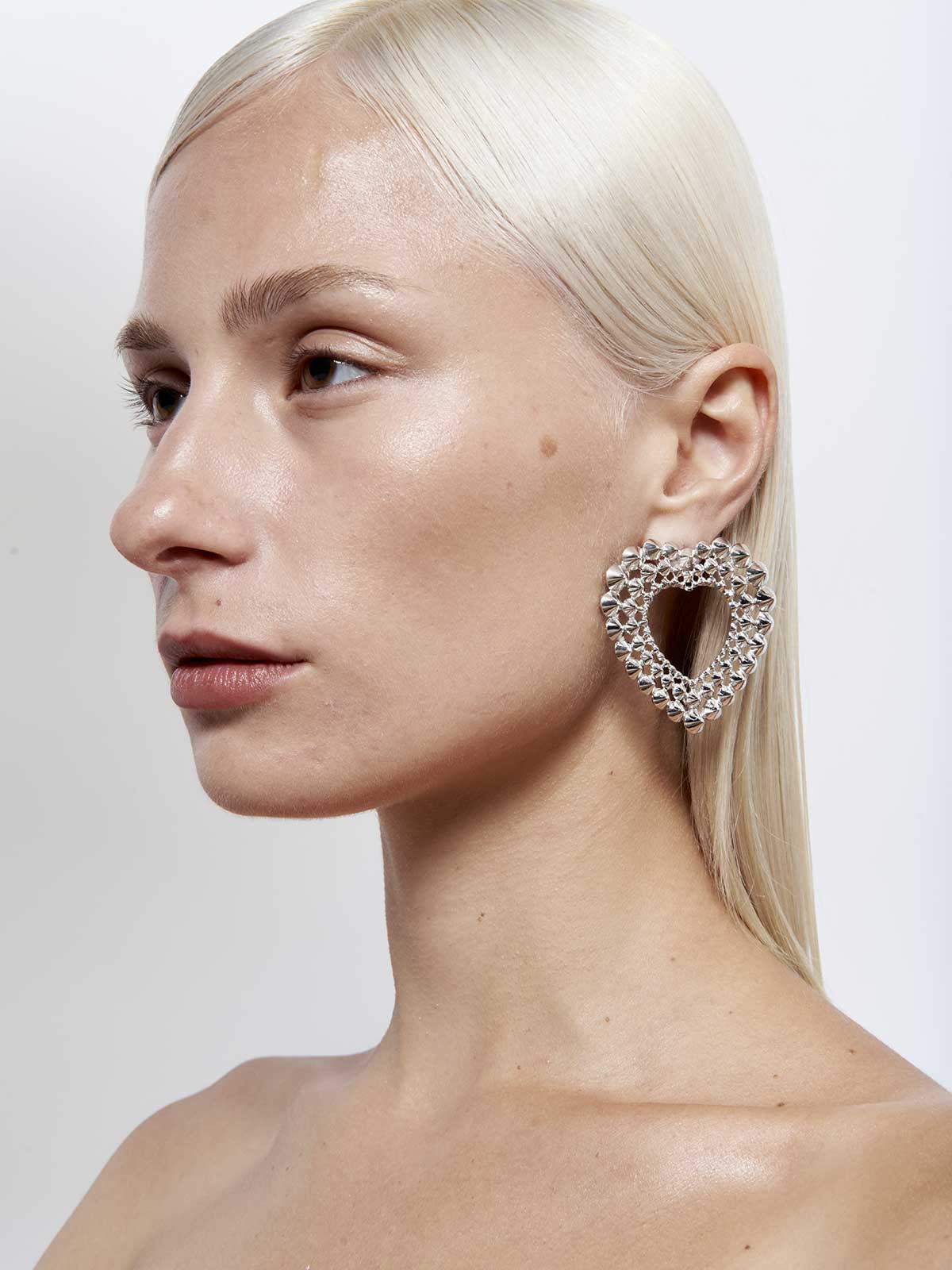 French designer punk rock couture fashion luxury silver trendy sustainable statement spike studded heart earrings