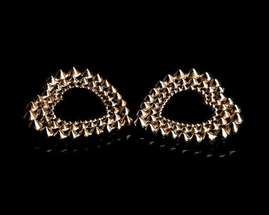 French designer punk rock couture fashion luxury gold trendy sustainable statement spike studded heart earrings 